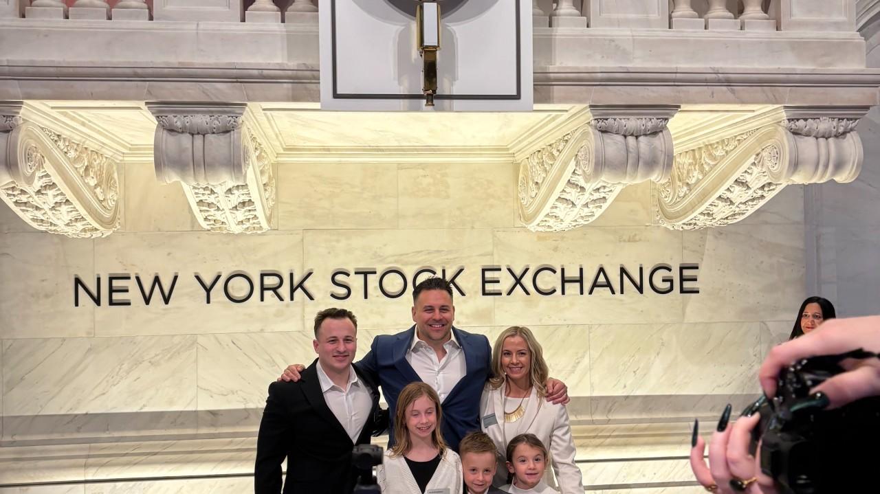 Chris Richardson with his father and siblings at the New York Stock Exchange